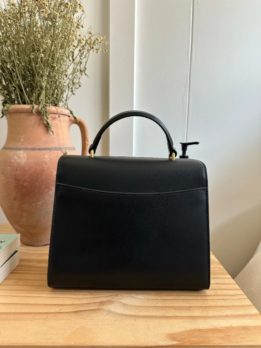 Quince black leather top-handle bag